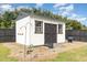 Functional shed with black trim and matching accents in backyard at 123 Jonalker Ct, Clayton, NC 27520