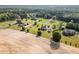 A captivating aerial view capturing the landscape of houses, lawns and trees in a beautiful community at 130 Skipwith Dr, Wendell, NC 27591