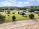 Picturesque aerial view showcasing a spacious property with lush green lawns and fencing at 130 Skipwith Dr, Wendell, NC 27591