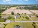 Aerial view of neighborhood with mature trees and large open field nearby at 130 Skipwith Dr, Wendell, NC 27591