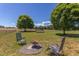 A relaxing backyard setting includes a fire pit and ample space for outdoor entertaining at 130 Skipwith Dr, Wendell, NC 27591