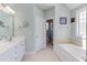 Large bathroom with double sinks, soaking tub, and plenty of counter space at 130 Skipwith Dr, Wendell, NC 27591