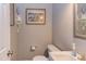Cozy half bathroom featuring a modern toilet and sink at 130 Skipwith Dr, Wendell, NC 27591