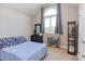 Cozy bedroom with a vaulted ceiling, a large arched window, and elegant decor at 130 Skipwith Dr, Wendell, NC 27591
