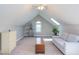 Bright bonus room with carpet flooring, a comfortable couch, and plenty of natural light at 130 Skipwith Dr, Wendell, NC 27591