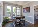 A view of the dining area featuring a wood table and seating, with a nearby view to the backyard at 130 Skipwith Dr, Wendell, NC 27591