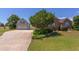 Charming home with brick and siding, showcasing an attached garage and well-manicured landscaping at 130 Skipwith Dr, Wendell, NC 27591