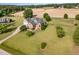 A beautiful aerial view showcasing this brick home's spacious yard and charming architectural details at 130 Skipwith Dr, Wendell, NC 27591