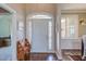 Inviting foyer with hardwood floors, a decorative bench and views into adjacent rooms at 130 Skipwith Dr, Wendell, NC 27591