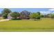 Inviting brick home on a large lot with well-maintained lawn and established trees at 130 Skipwith Dr, Wendell, NC 27591