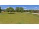 A sprawling front yard featuring a manicured lawn and mature shade trees at 130 Skipwith Dr, Wendell, NC 27591