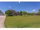 Expansive front lawn with landscaping and a brick home in the background at 130 Skipwith Dr, Wendell, NC 27591