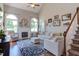 Spacious living room with a fireplace, large windows, and comfortable seating at 130 Skipwith Dr, Wendell, NC 27591