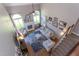 Bright, open living room featuring a fireplace, large windows, and hardwood floors at 130 Skipwith Dr, Wendell, NC 27591