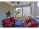 Inviting screened porch with ceiling fan and outdoor furniture, creating a cozy atmosphere at 130 Skipwith Dr, Wendell, NC 27591