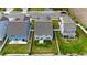 The aerial view captures the home with its fenced yard, patio, and well-kept lawn at 1305 Addison Lake St, Fuquay Varina, NC 27526