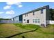 A spacious backyard is enclosed by a white fence, with a well-kept lawn and a patio area at 1305 Addison Lake St, Fuquay Varina, NC 27526