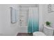 Bathroom features a shower with tub and gray wood-look flooring at 1305 Addison Lake St, Fuquay Varina, NC 27526