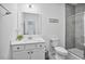 Bathroom featuring a white vanity and a tiled shower with a glass door at 1305 Addison Lake St, Fuquay Varina, NC 27526