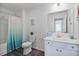 Bright bathroom features a modern vanity with white cabinets and a framed mirror at 1305 Addison Lake St, Fuquay Varina, NC 27526