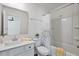 Bright bathroom featuring a white vanity, decorative shower curtain, and combined bathtub and shower at 1305 Addison Lake St, Fuquay Varina, NC 27526