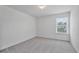 An empty bedroom with neutral walls and carpet at 1305 Addison Lake St, Fuquay Varina, NC 27526