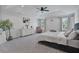 Spacious Primary bedroom featuring a tray ceiling, carpet floors, and natural light at 1305 Addison Lake St, Fuquay Varina, NC 27526