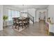 Comfortable dining area with hardwood floors, stylish chandelier, and convenient access to other living spaces at 1305 Addison Lake St, Fuquay Varina, NC 27526