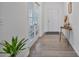 Bright entryway features hardwood floors, French doors, stylish decor, and a welcoming atmosphere at 1305 Addison Lake St, Fuquay Varina, NC 27526