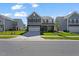 Inviting two-story home with a two-car garage, well-manicured lawn, and curb appeal in a friendly neighborhood at 1305 Addison Lake St, Fuquay Varina, NC 27526