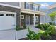 Welcoming front entrance of a charming home with stone detailing and a two-car garage at 1305 Addison Lake St, Fuquay Varina, NC 27526