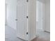 Hallway with open doors and carpeted floor at 1305 Addison Lake St, Fuquay Varina, NC 27526