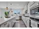 Well-equipped kitchen with stainless steel appliances, island, and ample counter space at 1305 Addison Lake St, Fuquay Varina, NC 27526
