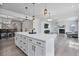 Spacious island in a modern kitchen with a clear view to the dining room and living room at 1305 Addison Lake St, Fuquay Varina, NC 27526
