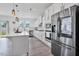 Modern kitchen featuring stainless appliances, a quartz island, and pendant lighting at 1305 Addison Lake St, Fuquay Varina, NC 27526