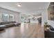 Open concept living space with kitchen, dining, and living areas connected and lots of light at 1305 Addison Lake St, Fuquay Varina, NC 27526