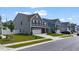 Street view of lovely two-story home, showcasing its exterior features and well-kept lawn with neighborhood homes at 1305 Addison Lake St, Fuquay Varina, NC 27526