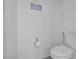 Toilet and toilet paper holder shown in bathroom at 1305 Addison Lake St, Fuquay Varina, NC 27526