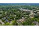 Aerial view of the property nestled among mature trees, located at 1313 Ridge Rd at 1313 Ridge Rd, Raleigh, NC 27607