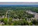 Aerial view of the property's neighborhood at 1313 Ridge Rd, surrounded by lush greenery and mature trees at 1313 Ridge Rd, Raleigh, NC 27607