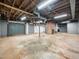 The unfinished basement is perfect for storage and features exposed beams at 1313 Ridge Rd, Raleigh, NC 27607