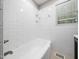 Clean bathroom features a bathtub with white subway tile surround at 1313 Ridge Rd, Raleigh, NC 27607