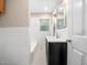 Updated bathroom features a black vanity, white subway tile surround, and neutral paint at 1313 Ridge Rd, Raleigh, NC 27607