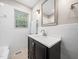 Updated bathroom features a modern vanity, white subway tile surround, and neutral paint at 1313 Ridge Rd, Raleigh, NC 27607