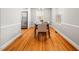 Bright dining room with hardwood floors, neutral walls, and a window for natural light at 1313 Ridge Rd, Raleigh, NC 27607