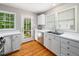 Functional kitchen with white cabinetry, stainless steel appliances, and a convenient double sink at 1313 Ridge Rd, Raleigh, NC 27607