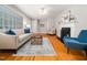 The living room features hardwood floors, bright paint, and a cozy ambiance at 1313 Ridge Rd, Raleigh, NC 27607