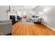 A cozy living room with hardwood floors and large windows at 1313 Ridge Rd, Raleigh, NC 27607
