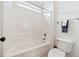 Clean bathroom with a tub/shower, tiled walls, and neutral accents creating a relaxing atmosphere at 1328 Palace Garden Way, Raleigh, NC 27603