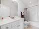 Clean bathroom with a tub/shower, tiled walls, and neutral accents creating a relaxing atmosphere at 1328 Palace Garden Way, Raleigh, NC 27603